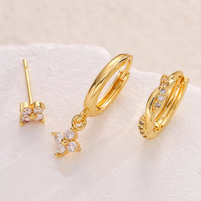 Conjunto de 3 brincos de argola com pingente de flor